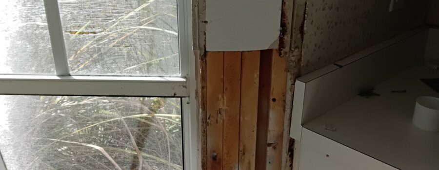 Water damage, mold remediation, and restoration beneath a breakfast nook window in a Sarasota, Florida home.