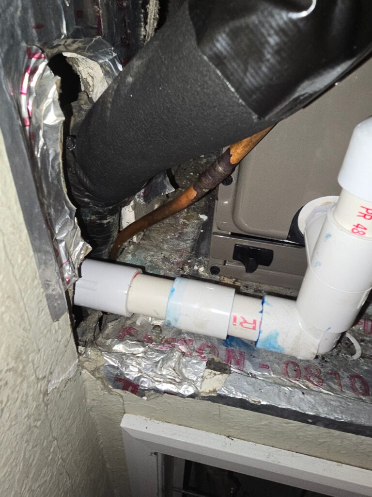 Exposed plumbing and HVAC components during residential mold remediation project in Bradenton Florida