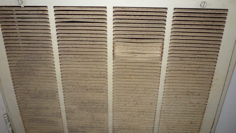 HVAC air handler component with accumulated dust and debris before professional air handler and air duct cleaning in Paver Park Sarasota Florida