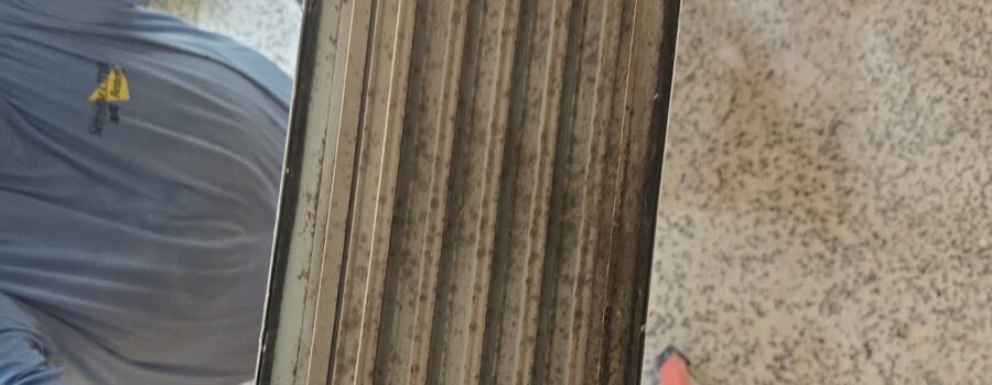 HVAC register with heavy accumulated debris removed for cleaning during a Bradenton mold remediation project.